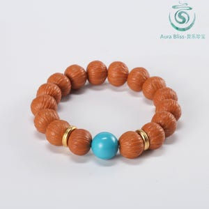 May include: A brown beaded bracelet with a turquoise bead and gold accents. The bracelet features large, textured brown beads and a single, smooth turquoise bead. The gold accents add a touch of elegance to the design.