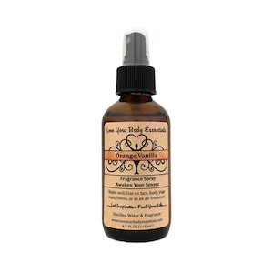 May include: A brown glass bottle with a black spray top. The label is brown with a white border and says "Love Your Body Essentials" in a brown font. The bottle contains Orange Vanilla fragrance spray. The label also says "Awaken Your Senses" and "Let Inspiration Fuel Your Life".