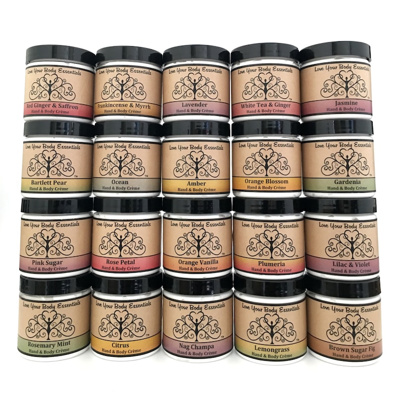 May include: Twenty-four small jars of hand and body cream with various scents, including Lavender, Jasmine, Orange Blossom, and Rose Petal. Each jar has a black lid and a label with a tree design and the brand name "Love Your Body Essentials".