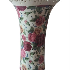 Vintage Ceramic Chintz Vase Adorned With A Floral Embellishment.