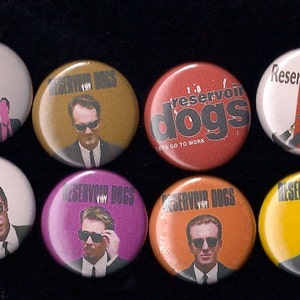 May include: Eight round button pins featuring characters from the movie Reservoir Dogs. The buttons are in various colors, including red, orange, yellow, green, and purple. The buttons feature the movie title and characters from the film.