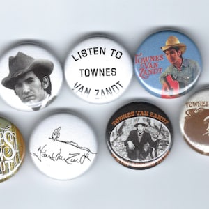 May include: A collection of seven round buttons featuring images and text related to Townes Van Zandt. The buttons display portraits, signatures, and phrases like "Listen to Townes Van Zandt." Colors include black, white, brown, and blue.