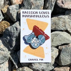 Raccoon Loves Marshmallows Black Nickel Enamel Pin image 1