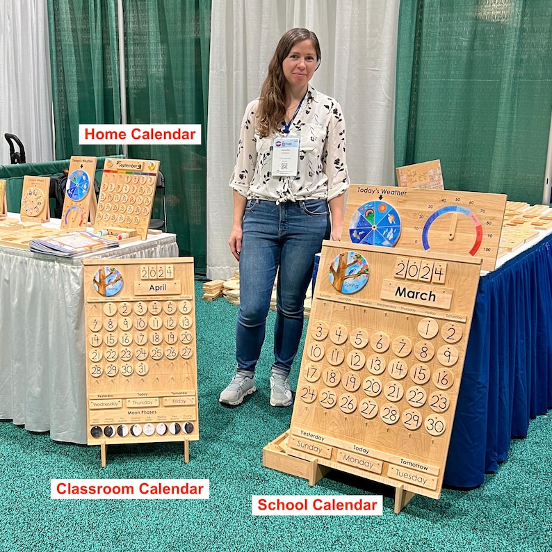 May include: A wooden perpetual calendar set featuring a light wood finish, circular date markers, and interchangeable month and year tiles. The boards include sections for weather, moon phases, and days of the week, labelled Home Calendar, Classroom Calendar, and School Calendar.