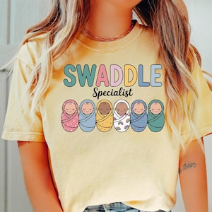Swaddle Specialist Shirt, NICU Nurse Shirt, Labor and Delivery Nurse Tee, Neonatal ICU Gift, Mother Baby Unit Shirt