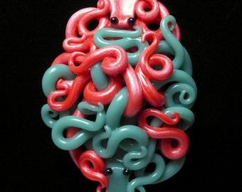 Large Translucent Ocean Blue and Shimmery Salmon Pink Hugging Octopus Necklace