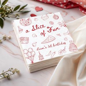 May include: A stack of white paper napkins featuring red line art illustrations of pizza, party hats, balloons, a birthday cake, and gifts. The text reads "a Slice of Fun" and "Liam's 1st birthday" in a red script font, centered on the top napkin surface.