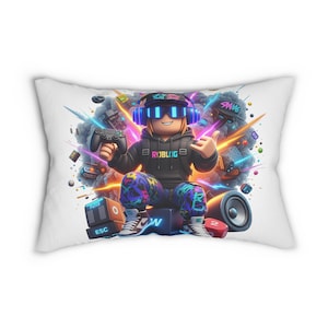 May include: White rectangular pillow featuring a cartoon gamer character wearing a headset and holding a game controller. The character is surrounded by colorful graphics and gaming-related elements. The pillow has a soft, plush appearance.