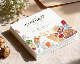May include: A stack of white paper napkins with a watercolor illustration of pasta, meatballs, and eggs. The text "A little meatball is in the oven" and "Olivia Wilson Bridal Shower" is printed on the napkins.