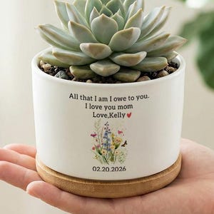 May include: A set of three ceramic mugs with a speckled, matte finish. The mugs are in shades of cream, light gray, and dark gray. Each mug has a simple, minimalist design and a rounded handle.