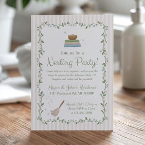 Peut inclure: Une carte d'invitation rectangulaire avec une bordure rayée beige clair et un cadre de vigne verte orné de fleurs bleues. Le texte indique Join us for a Nesting Party! chez Megan & John's Residence, 1517 Westwood Rd, ME 04000, le 21 mars, 12-4pm.