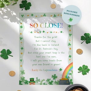 May include: A St. Patrick's Day themed print with the text "SO CLOSE!" in rainbow colors. The print features a leprechaun, a pot of gold, a rainbow, and shamrocks. Gold coins and shamrock decorations surround the print.