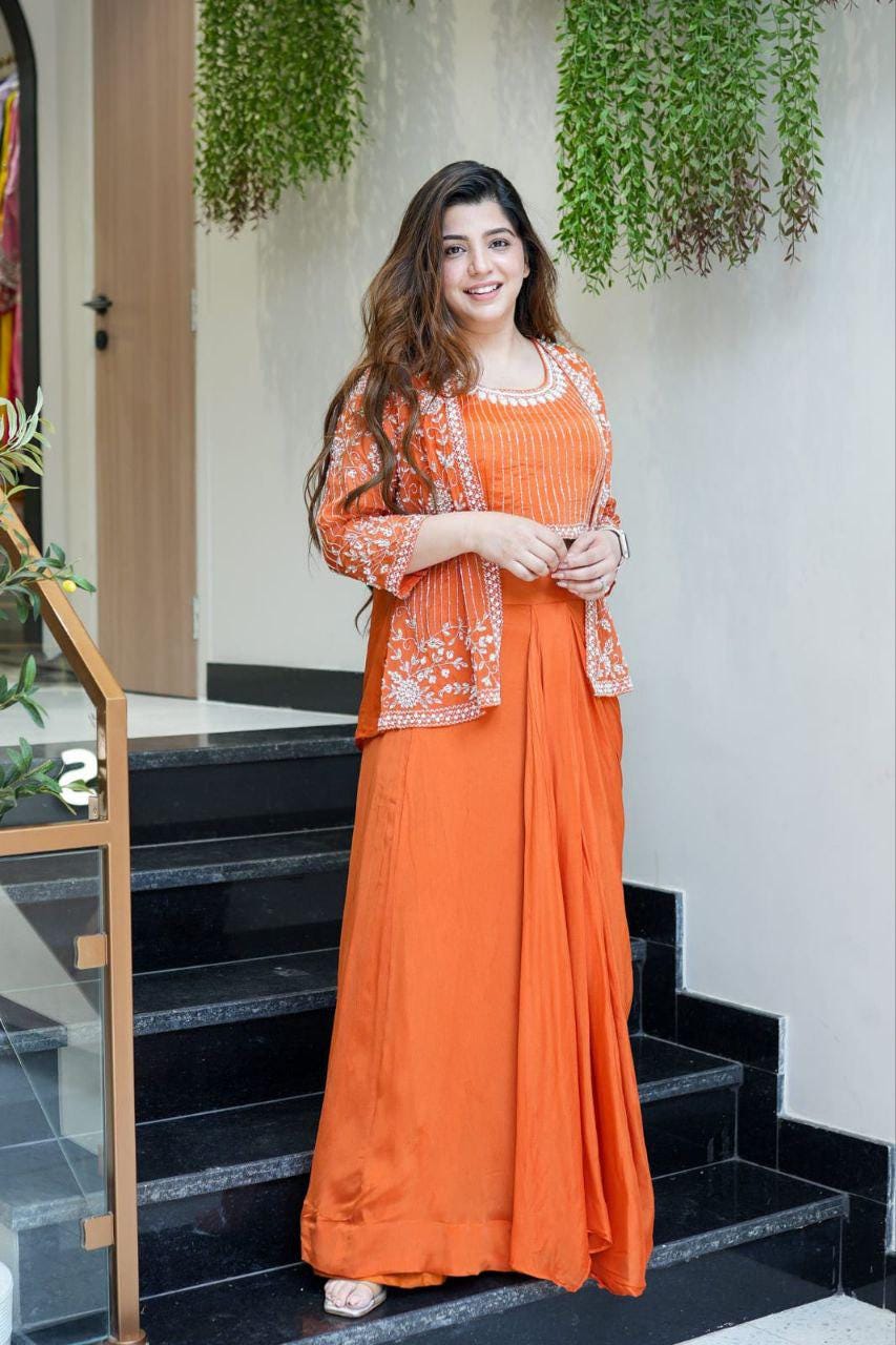 orange indo western dress for women Introducing our exquisite Tangerine Orange Indo Western Outfit, a must-have for all bridesmaids! Whether it's a sangeet, carnival, haldi, or any special occasion, this is the perfect choice to make heads