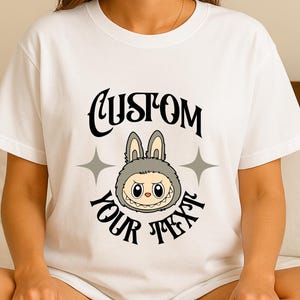 Labubu Smirk T-Shirt, Cute Kawaii Shirt with Funny Face and Stars, Minimal Style for Fans and Collectors