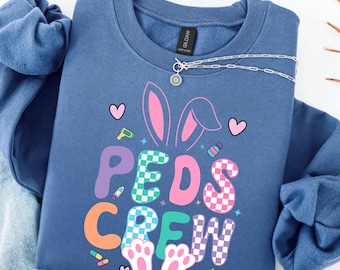 小児科看護師のイースタースウェットシャツ、かわいいイースター小児科看護師パーカー、小児科医へのギフトアイデア、PICU看護師への感謝、未来の小児科クルーTシャツ
