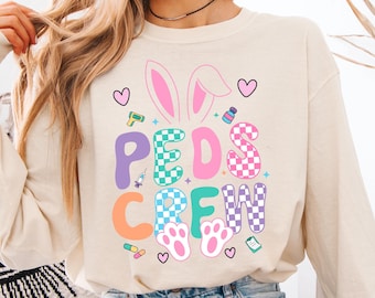 小児科看護師のイースタースウェットシャツ、かわいいウサギの医療用シャツ、小児科医へのギフトアイデア、PICU看護師への感謝、未来の小児科クルーシャツ