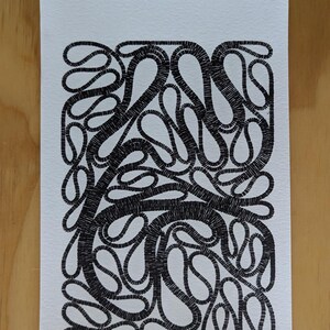 May include: Black and white abstract art print. The artwork features a dense pattern of interconnected, looping lines, creating a textured, organic design. The lines are thick and appear to be hand-drawn, giving the piece a unique, artistic feel.