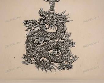 May include: A silver-colored pendant featuring a detailed dragon design. The dragon is depicted with intricate scales, claws, and a flowing mane, surrounded by stylized clouds. The pendant hangs from a matching chain.