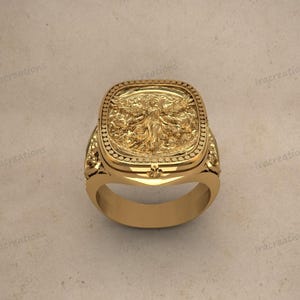 Oxidized antique style angel ring with rectangular frame.