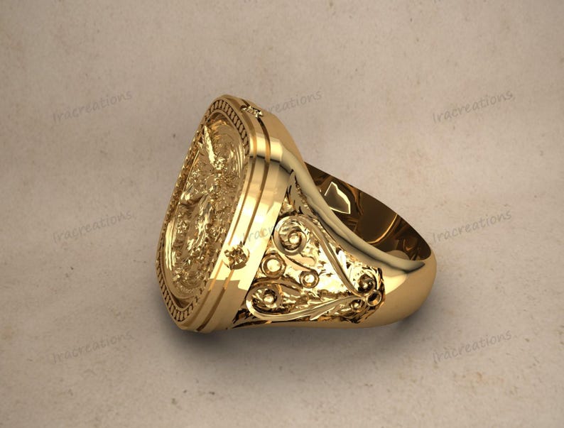 Unisex silver signet ring with angelic design.