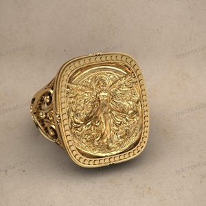 Angel wing relief signet ring handcrafted in silver.