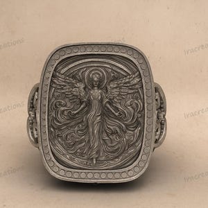 Sterling silver angel signet ring with detailed relief design.
