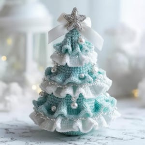 May include: A handcrafted crochet Christmas tree in teal and white, decorated with pearl beads and a silver star. The tree has a layered design with frilled edges and a white ribbon bow.
