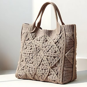 Può includere: Borsa tote beige con motivo floreale. La borsa presenta due manici e un design strutturato. Il motivo floreale è realizzato in materiale tessuto, creando un aspetto strutturato. Adatta per trasportare vari oggetti.