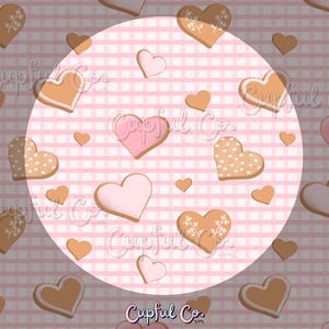 May include: A repeating pattern of heart-shaped cookies and pink hearts on a pink and white checkered background. Some cookies have white frosting and floral designs. The image has the text "Cupful Co."