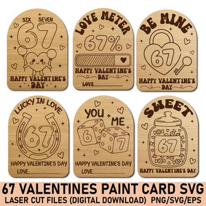 May include: Six wooden Valentine's Day cards featuring the number 67. Designs include a heart with balloons, a love meter, a lock and key, a horseshoe, dice, and a jar of sweets. Text includes "Happy Valentine's Day".