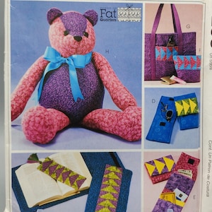May include: A sewing pattern for a teddy bear, tote bag, and book covers. The pattern is designed for use with fat quarters. The pattern is called McCall's Crafts P255.