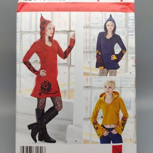 May include: Simplicity sewing pattern number 1251, size US 12-20, Euro 38-46, for a hooded top with long sleeves and a V-neck. The pattern includes three different styles: a red top with black floral embroidery, a blue top with yellow floral embroidery, and a yellow top with red floral embroidery.