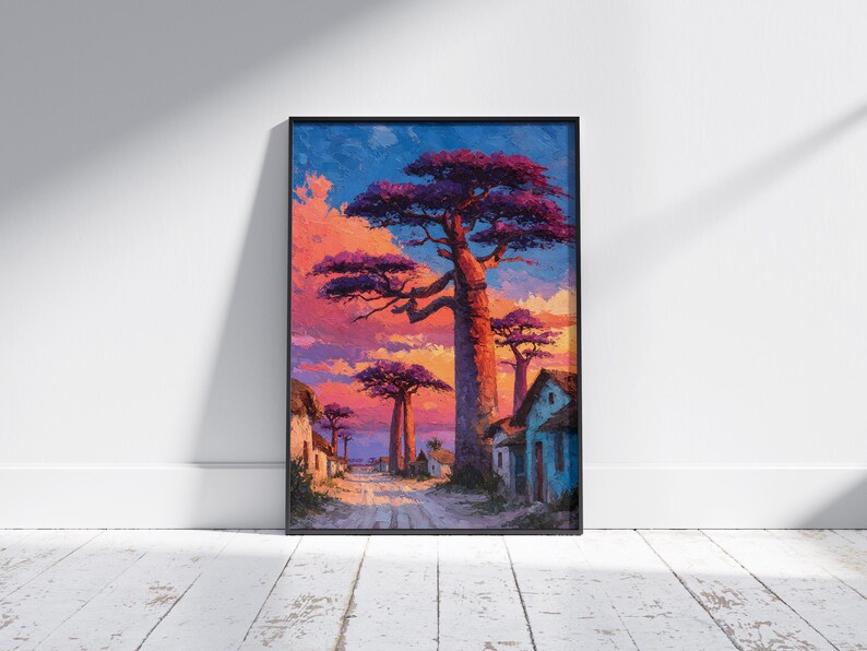 Puede incluir: Impresi&oacute;n art&iacute;stica enmarcada que representa un paisaje vibrante con &aacute;rboles de baobab y una carretera de pueblo. La obra de arte presenta un cielo de puesta de sol colorido con tonos de naranja, rosa y azul. Los &aacute;rboles tienen follaje p&uacute;rpura y los edificios est&aacute;n pintados en tonos apagados.