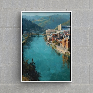 May include: A framed landscape painting depicts a river flowing through a city. The water is a vibrant teal, reflecting the buildings and bridge. Buildings with red brick and tan facades line the riverbanks, with green hills in the background.