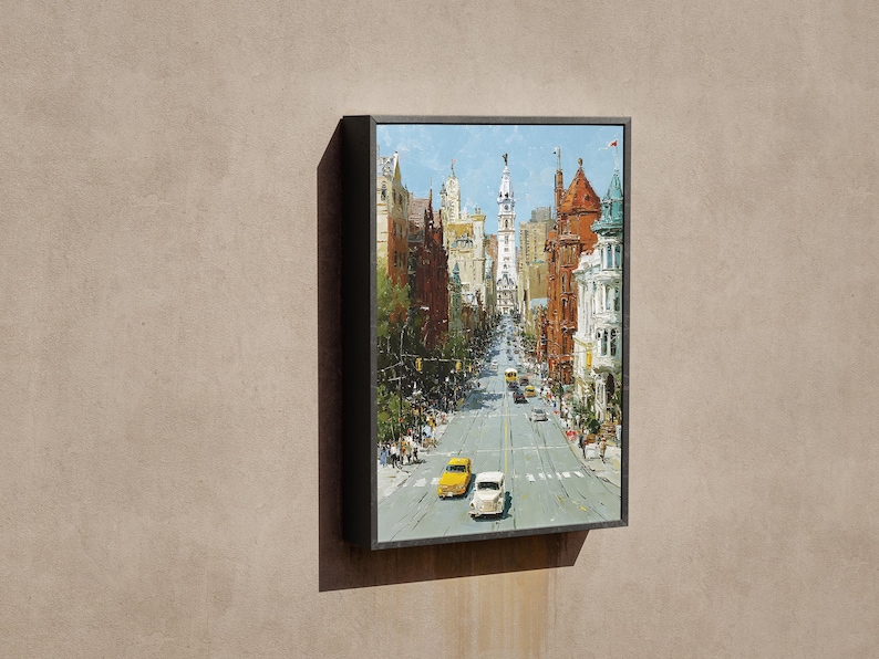 May include: A framed painting depicts a city street scene with buildings and cars. The artwork features a perspective view down a city street with yellow and white cars. The buildings are in shades of brown, red, and white, under a blue sky.