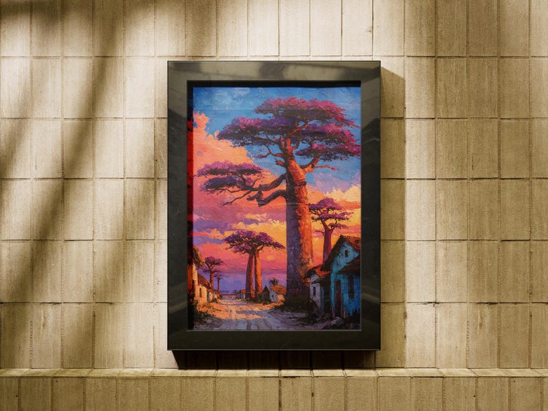Puede incluir: Pintura de paisaje enmarcada que representa una puesta de sol con &aacute;rboles de baobab. La obra presenta un camino que conduce a peque&ntilde;os edificios, con un cielo en tonos rosas, morados y azules. El marco es negro.