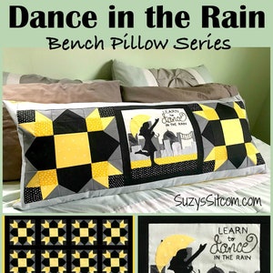 May include: A black and yellow patterned bench pillow with a black silhouette of a person dancing in the rain with an umbrella. The pillow has the text "Learn to Dance in the Rain".