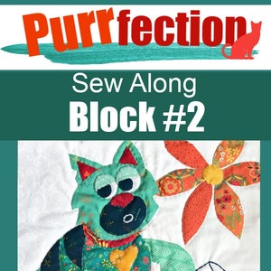 May include: A green cat with a yellow heart on its chest sits on a white background with a red flower and a glass of red wine. The text "Sew Along Block #2" is above the image. The text "SuzySSitcom.com" is below the image.