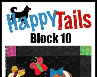 May include: Happy Tails Block 10 quilt block featuring a brown and white dog with a blue bow, a red heart, and a green ball. The dog is surrounded by colorful butterflies on a black background with white polka dots. The block is framed with colorful squares.