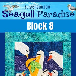 May include: A fabric block with a seagull design. It features white seagulls with orange beaks and feet, set against a blue and purple patterned background. The text reads "Seagull Paradise" and "Block 8".