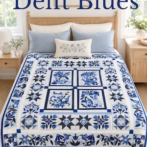 May include: A quilt featuring a white background with blue floral and geometric patterns, including four central rectangular panels with teapot and floral motifs, surrounded by star and bird borders. The text Delft Blues is at the top.