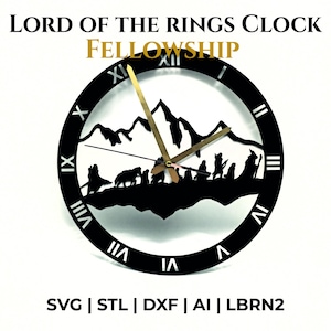May include: Black Lord of the Rings clock with Roman numerals and gold clock hands. The clock face features a silhouette of mountains and figures from the Fellowship. The text "LORD OF THE RINGS CLOCK FELLOWSHIP" is at the top.