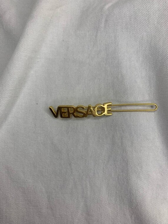 Versace Gold Logo Hair Accessory VERSACE Logo Hair Clip in Gold | FWRD main image 3