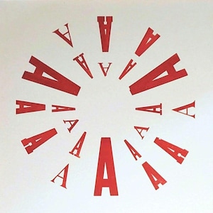 May include: A set of three ceramic canisters with lids, featuring a geometric pattern in shades of blue, white, and gray. The canisters vary in size, suitable for kitchen storage.