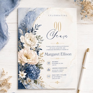 Op de afbeelding: Een uitnodigingskaart voor een 90e verjaardag met een aquarelontwerp van blauwe en crèmekleurige bloemen, gouden accenten en de tekst Celebrating 90 Years, Margaret Ellison, Saturday September 26, 2026, 3:00 PM, Lakeside Conservatory, 440 Willow Terrace.