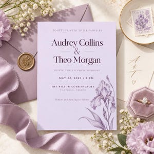 May include: A rectangular wedding invitation card in light purple with dark purple text reading Audrey Collins & Theo Morgan, May 22, 2027, 4 PM, The Willow Conservatory, Portland, Oregon. The card features a detailed purple iris illustration.