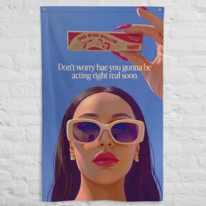 Puede incluir: Un estandarte vertical con fondo azul y una ilustración gráfica de una persona con gafas de sol color crema y pendientes de aro dorados. Arriba, una mano sostiene una caja con la etiqueta One Wish Willow y el texto Don't worry bae you gonna be acting right real soon.