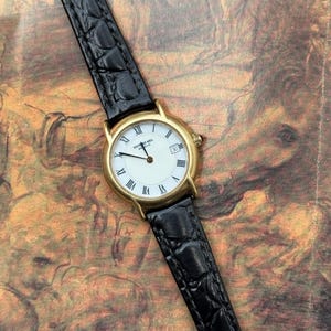 Vintage Raymond Weil 5897 Gold Plated Quartz Watch – Roman Numerals, Black Leather Strap, Date Window – Ladies Swiss Dress Watch