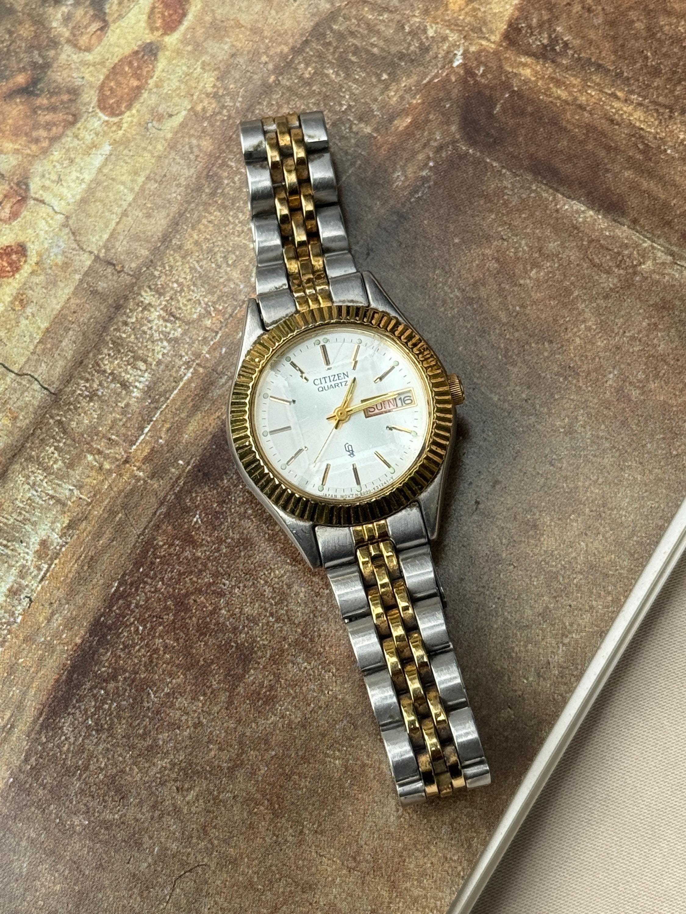 Elegant Citizen Quartz Two-Tone Gold and Silver Watch with Date Display Citizen Quartz Two Tone Day/Date Watch EQ0605-53A – Harris  main image 4