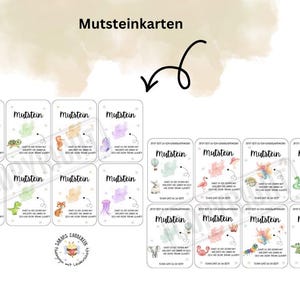 May include: A collection of small, rectangular cards with the word "Mutstein" at the top. Each card features a different watercolor illustration of animals and objects, such as a whale, seahorse, and hot air balloon. The cards have German text.